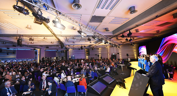 People listening to speech at the EWF 2024. 
